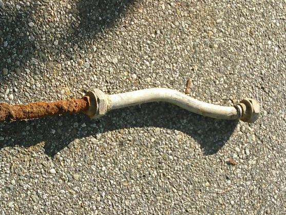 Lead goose neck connected to a steel pipe